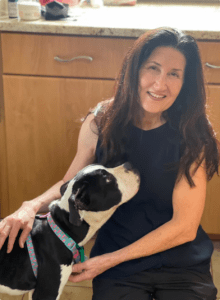 Wally receives cuddles from Doreen Barker, founder of The Animal League.